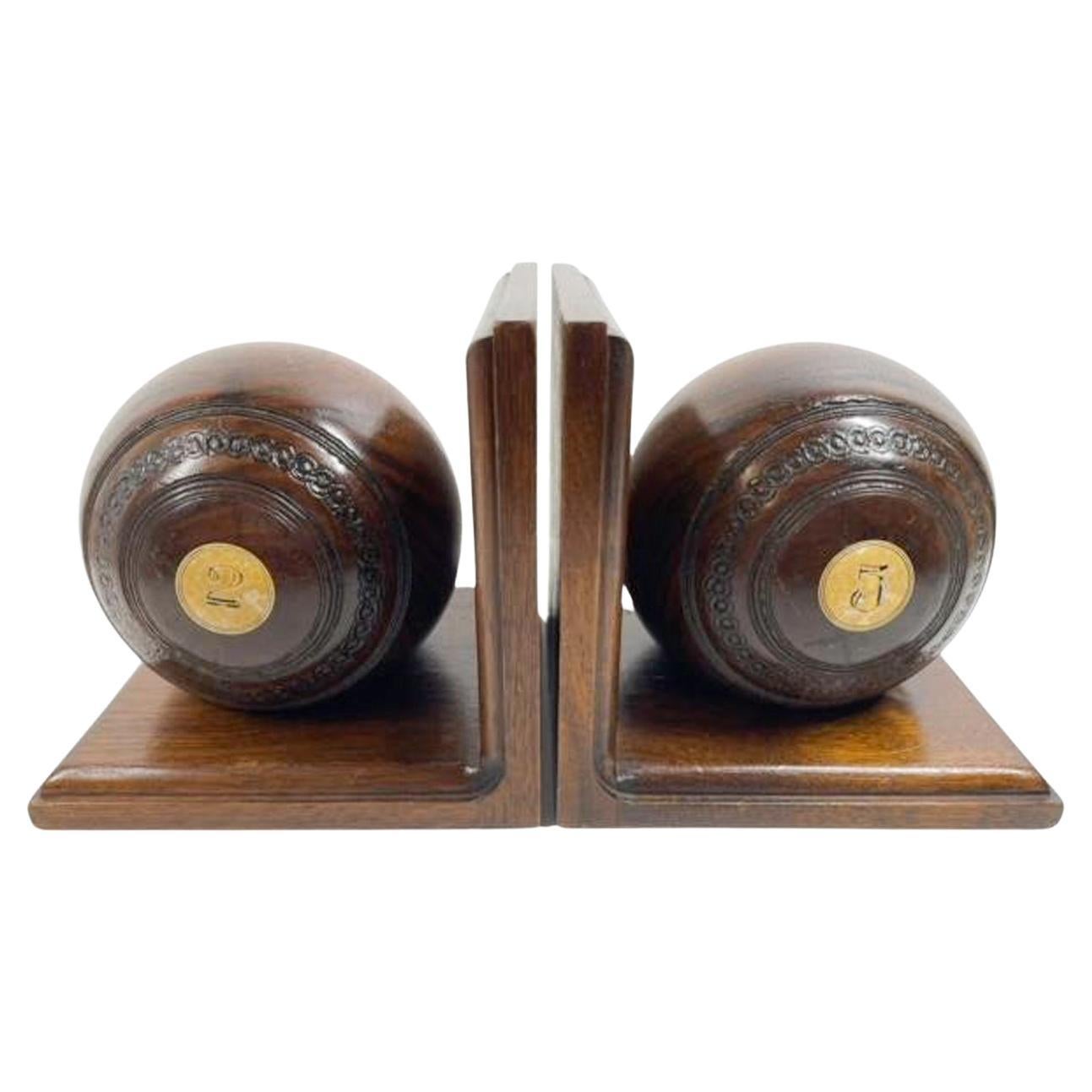 Pair of Early Twentieth Century Lignum Vitae Lawn Bowl on Custom Bookend Stands