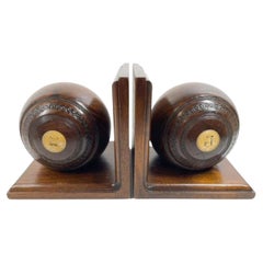 Pair of Early Twentieth Century Lignum Vitae Lawn Bowl on Custom Bookend Stands