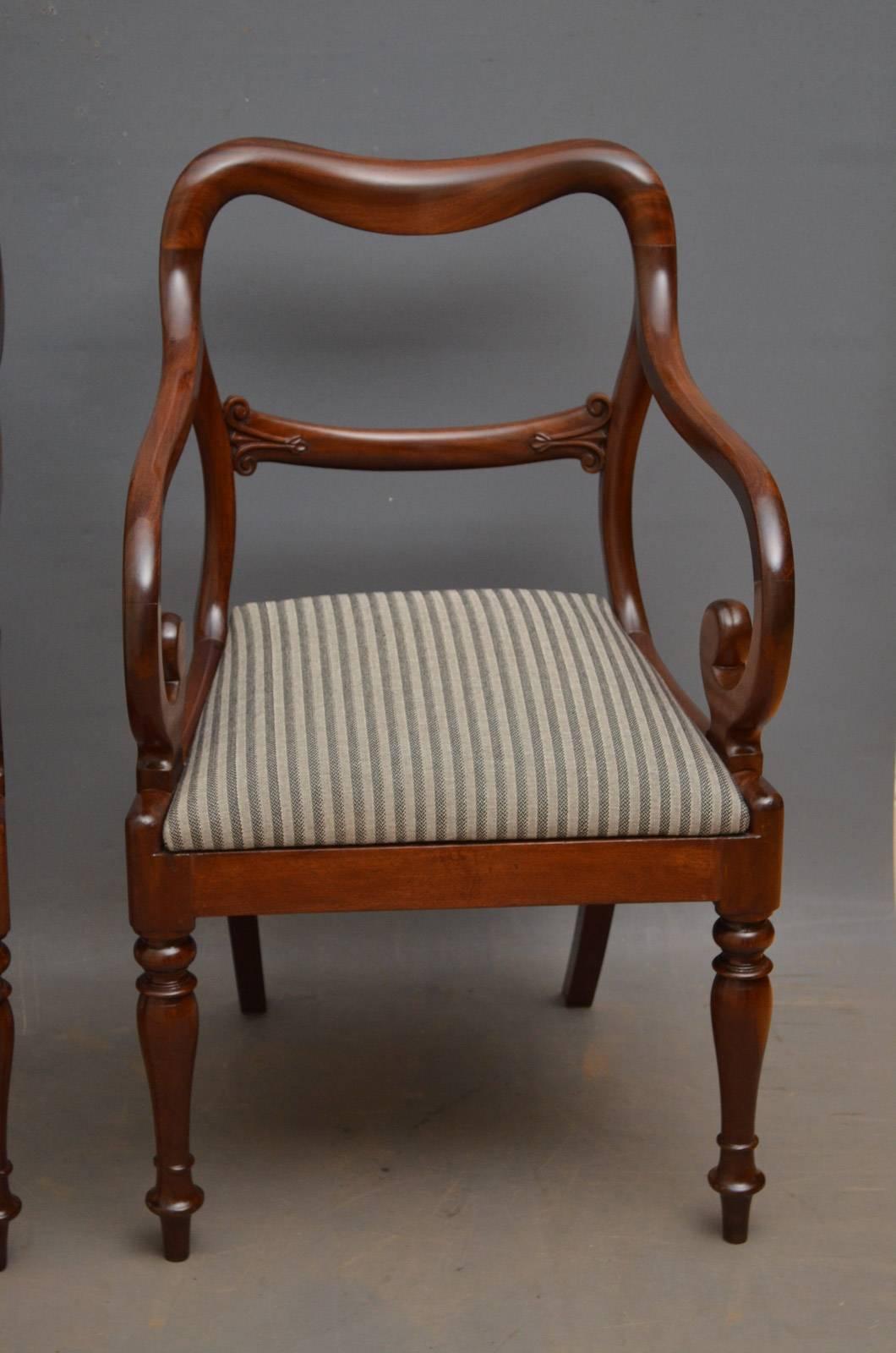 Sn4366 pair of superb quality early Victorian carver chairs in mahogany, having balloon back top rail with carved mid rail, newly upholstered drop in seat and open scroll arms, all standing on turned legs. These antique elbow chars retain original