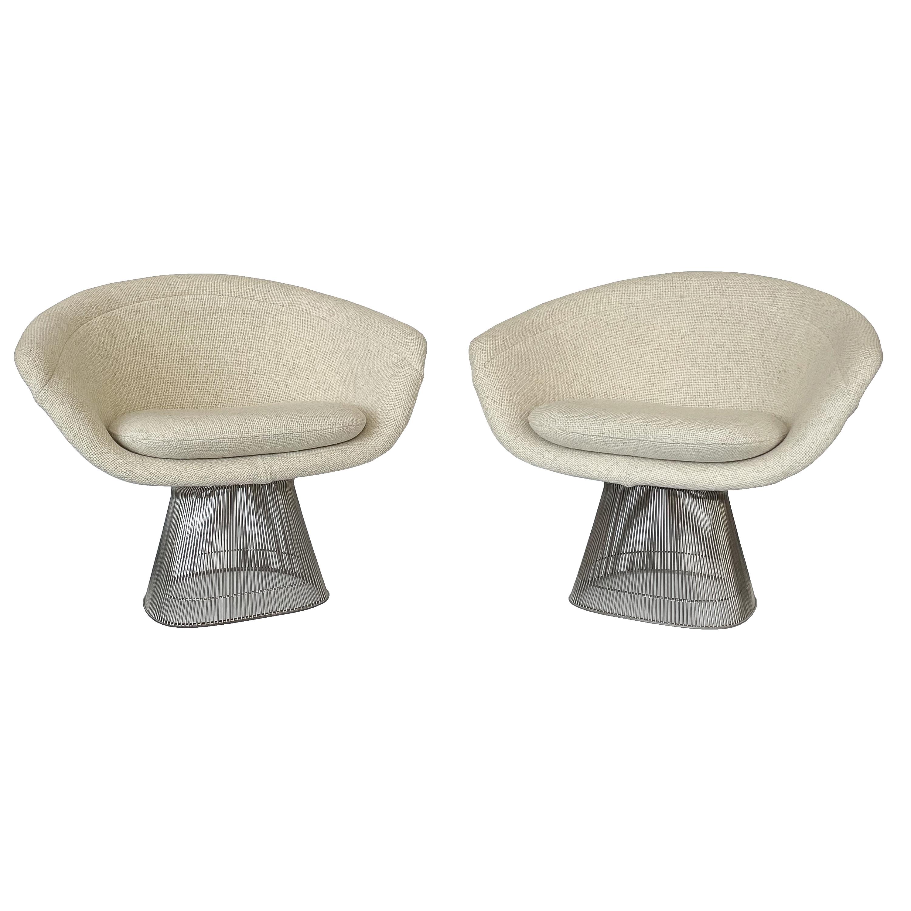 Pair of early Warren Platner wire lounge chairs for Knoll, circa 1970. Designed in 1966 and produced by Knoll, this pair is an early example from around 1970. Nickel plated steel wire framework with original heathered light oatmeal woven fabric back
