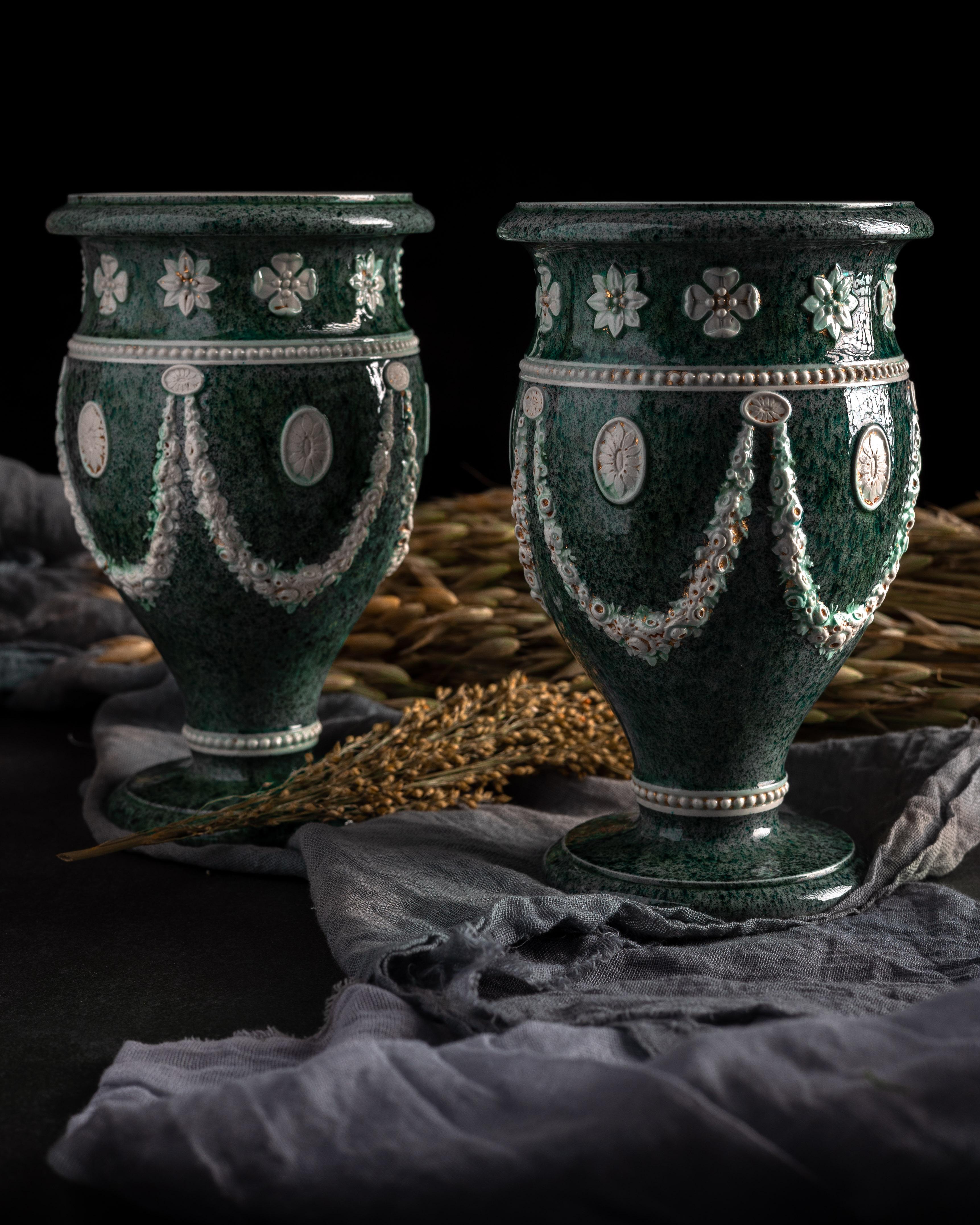A pair of early Wedgwood pearlware urns with faux porphyry glaze, made circa 1785.

Josiah Wedgwood developed his pearlware glaze in 1779 as a white-ware alternative to his wildly popular creamware, or ‘Queen’s ware.’ The glaze, named “Pearl