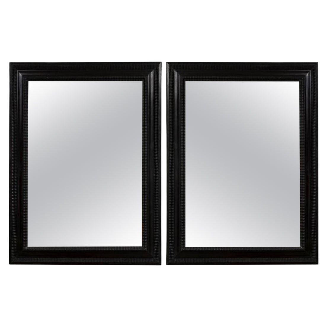 Paire de miroirs ébénisés de style baroque italien du début du XXe siècle en vente