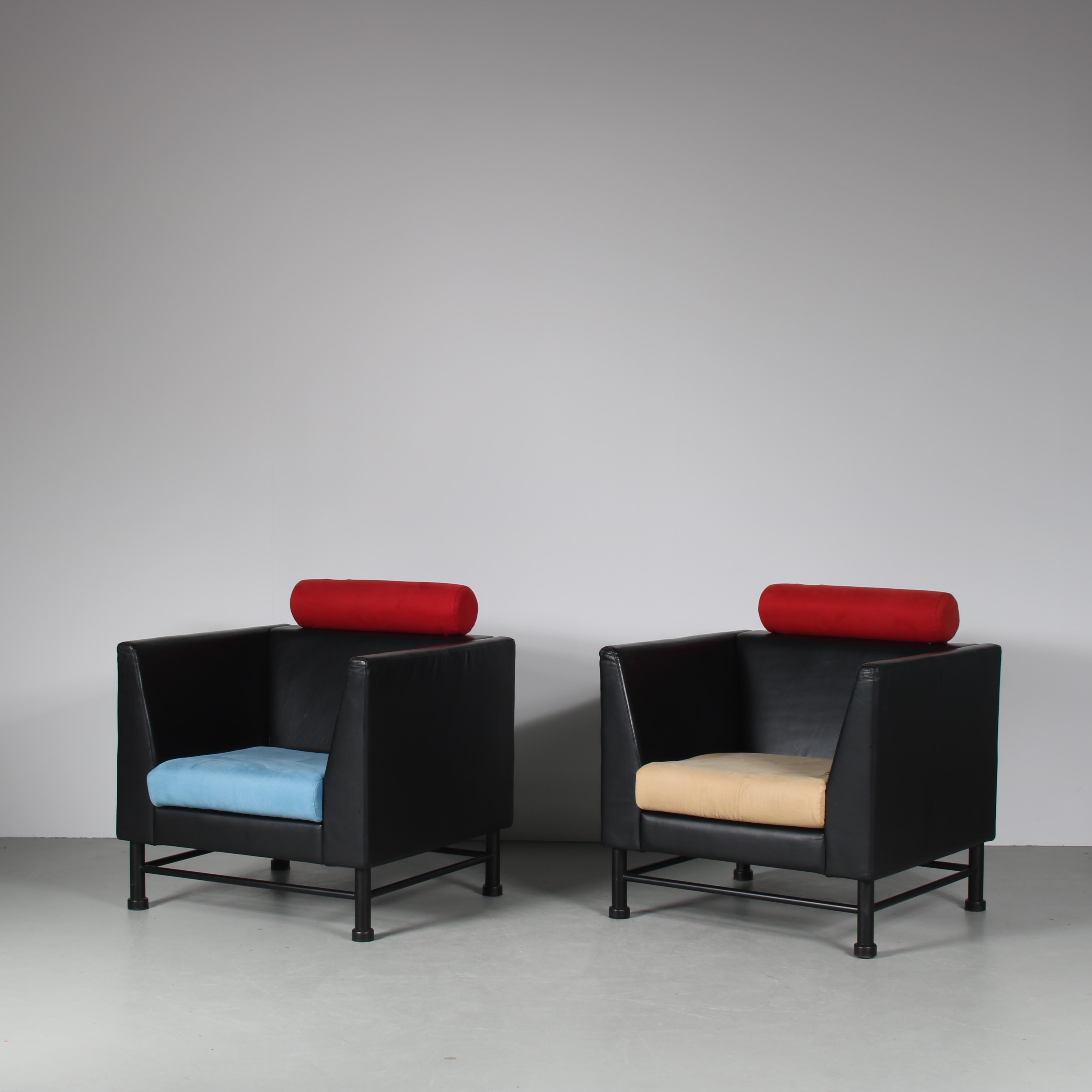 A wonderful pair of “Easy Side” chairs, designed by Ettore Sottsass and manufactured by Knoll International in the USA around 1980.

Made of high quality black leather with red suède neckrests. The seating cushions are also upholstered in suède,