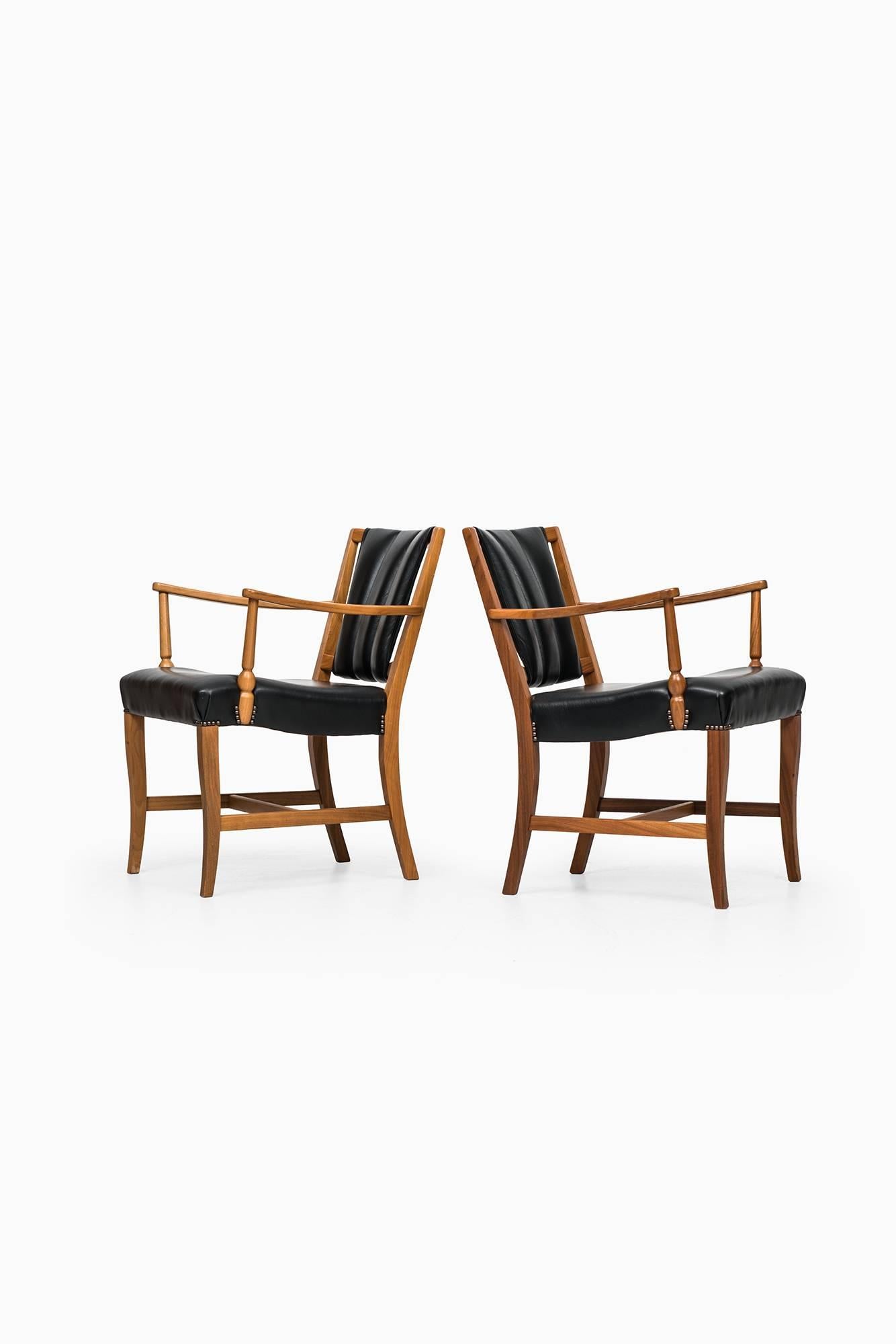 Rare pair of easy chairs / armchairs designed by Josef Frank. Produced by Svenskt Tenn in Sweden.