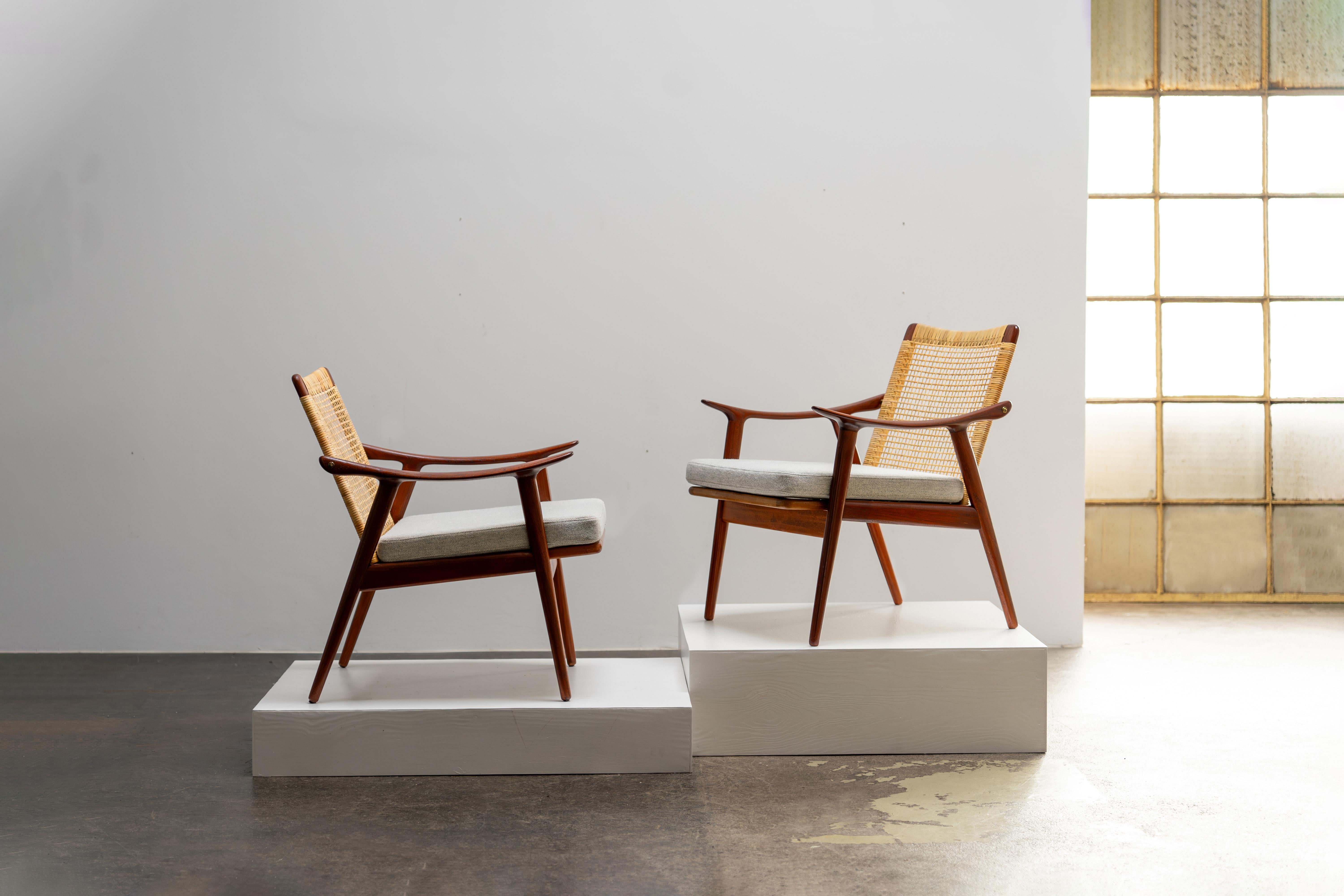Fredrik Kayser - lounge chairs for Vatne Lenestolfabrik, 1960s. Teak wood elegance meets a woven rattan back, paired with Kvadrat Hallingdal upholstery.
