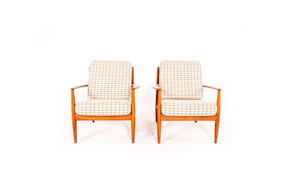 A pair of arm chairs, 1950s model FD-118 in teak and wool fabric by Grete Jalk for France and Daverkosen, marked FD. This is the earliest edition of this design. The chair feature the typical clear, comfortable lines in design Jalk has become famous
