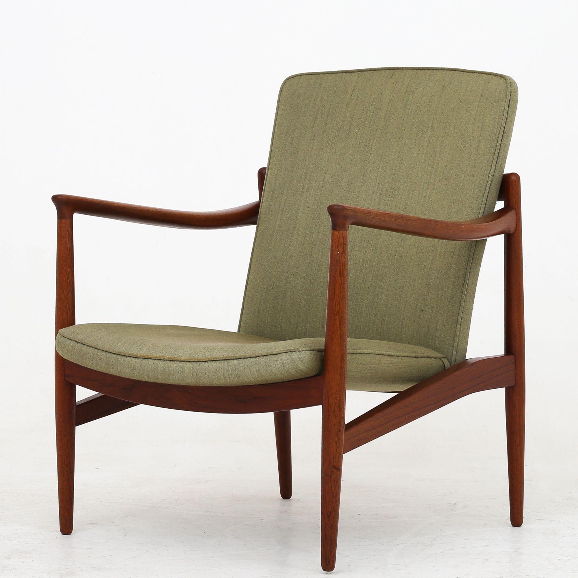 Easy chairs with solid teak frame, upholstered in original, green wool. Seat and back are adjustable. Originally mark from 1945. Jacob Kjær.