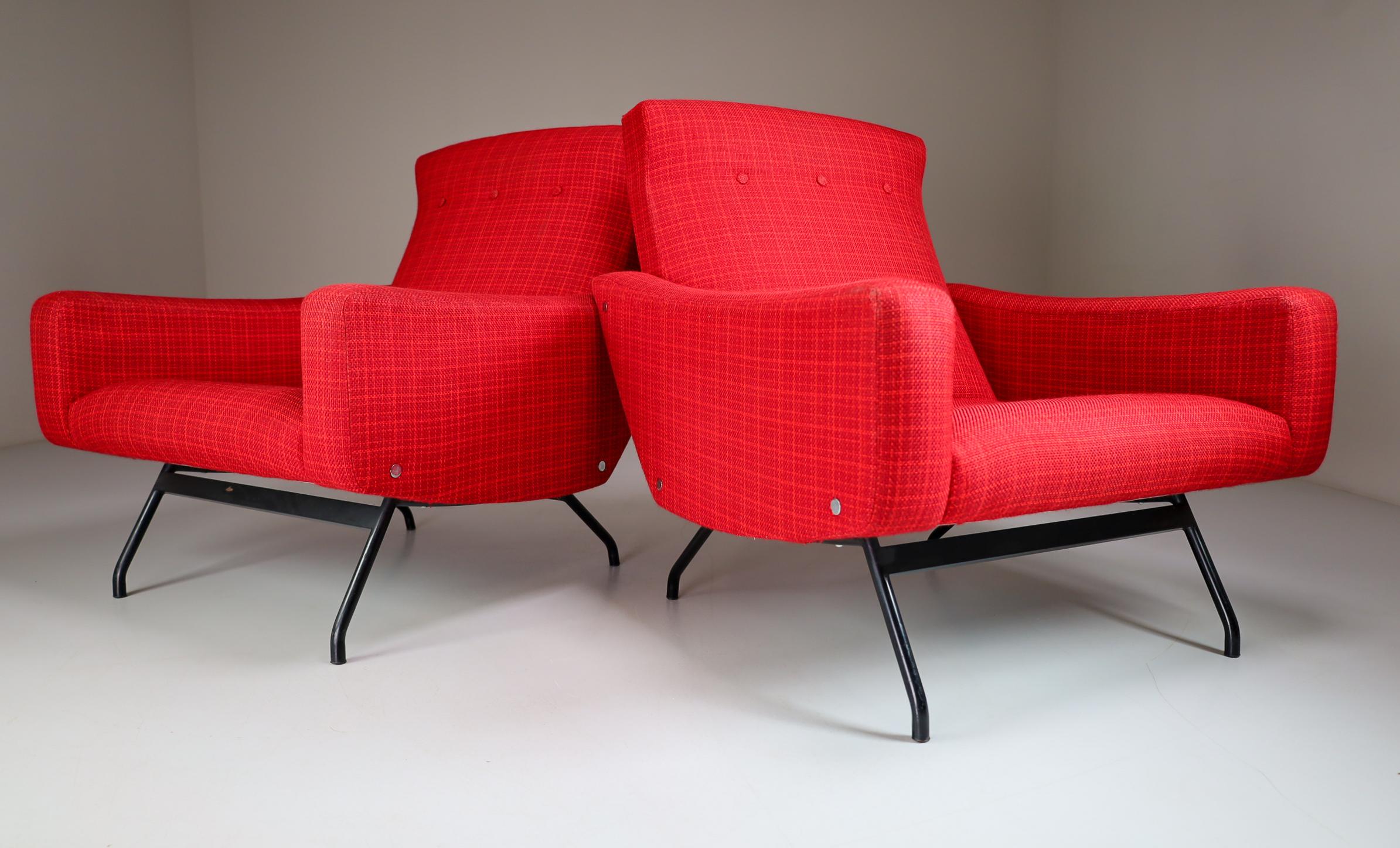 Interesting pair of easy chairs, designed by Joseph-Andre´ Motte, France 1950s.These well made armchairs were manufactured by Steiner and show wonderful craftsmanship. The red fabric upholstery is original and in amazing good condition. The design