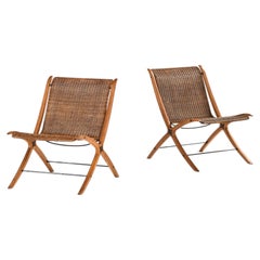 Juego de dos sillones de haya y ratán, diseño de Peter Hvidt y Orla Mølgaard-Nielsen, 1959