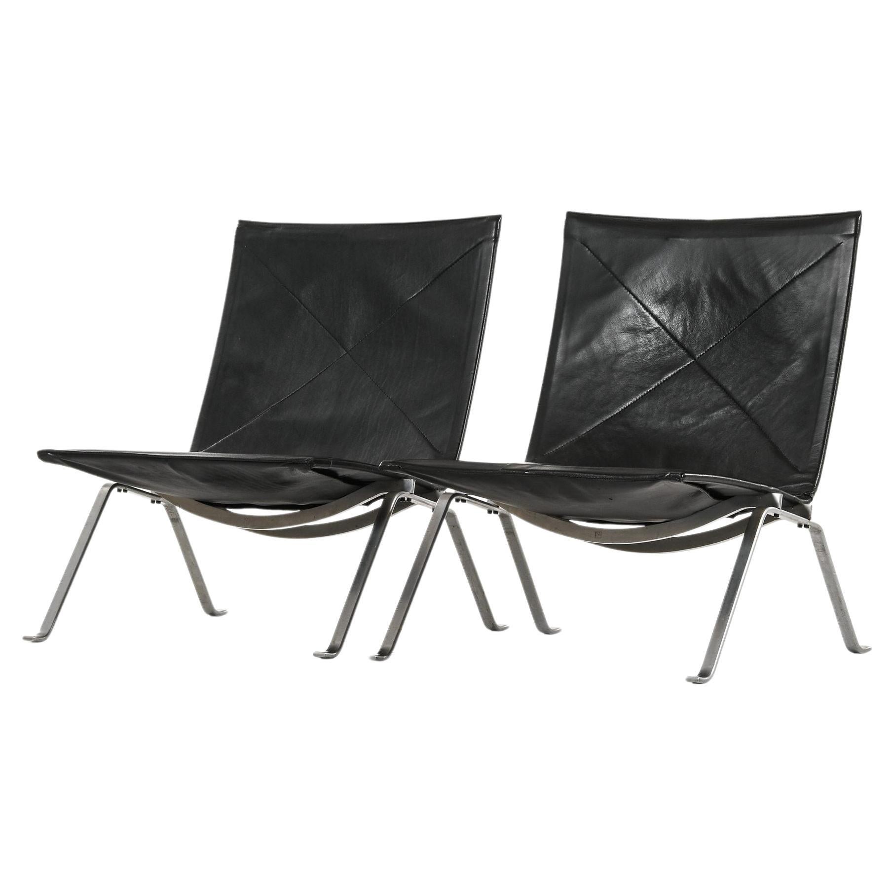 Pair of Easy Chairs in Black Leather and Steel by Poul Kjærholm, 1950's