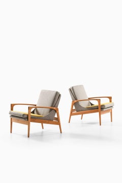 Coppia di poltrone in ottone, rovere e lana di Ib Kofod-Larsen, anni ’50