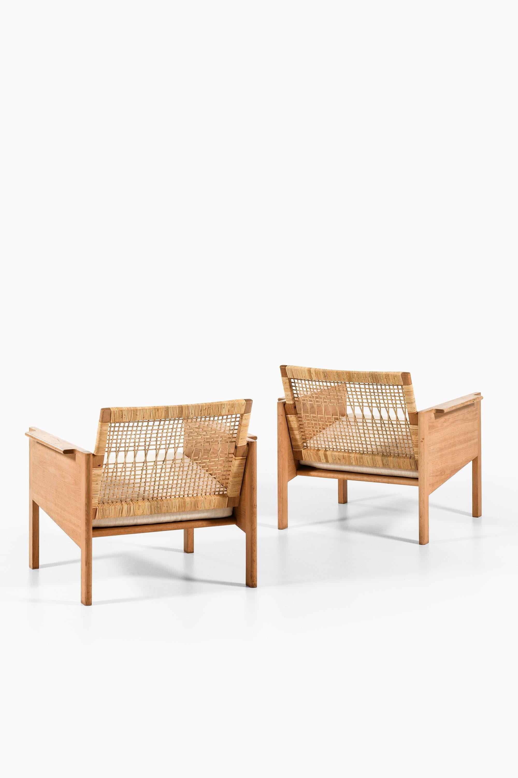 Danese Coppia di poltrone in Oak e canna di Kai Kristiansen, 1965 in vendita