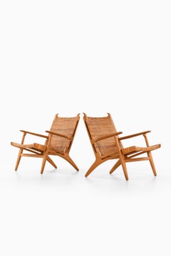 Pair of Easy Chairs in Oak, Woven Cane by Hans Wegner, 1949
