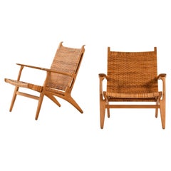 Paire de fauteuils en chêne, canne tissée par Hans Wegner, 1949