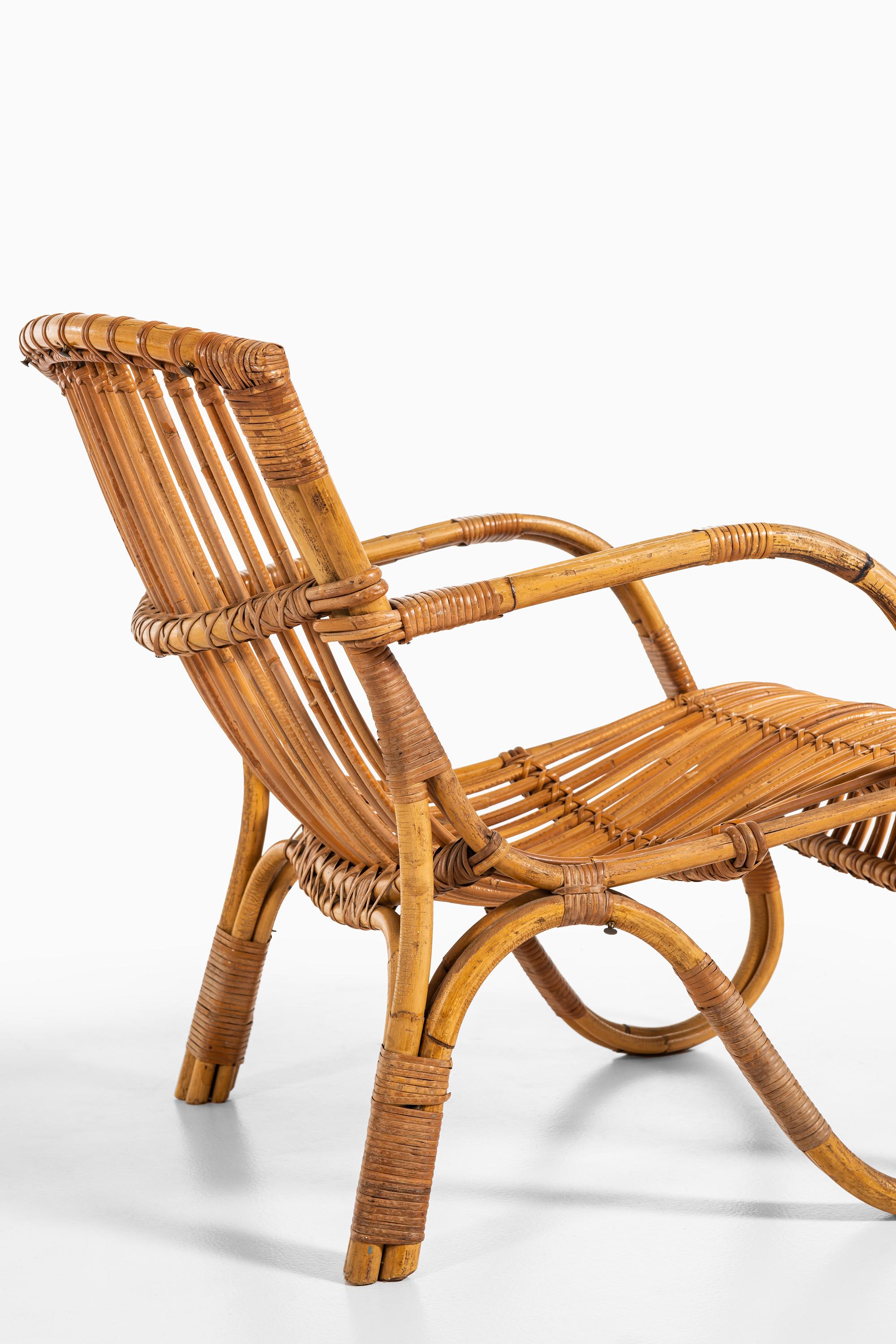 Scandinavian Modern Pair of Easy Chairs in Rattan and Cane by E.V.A. Nissen & Co in Denmark