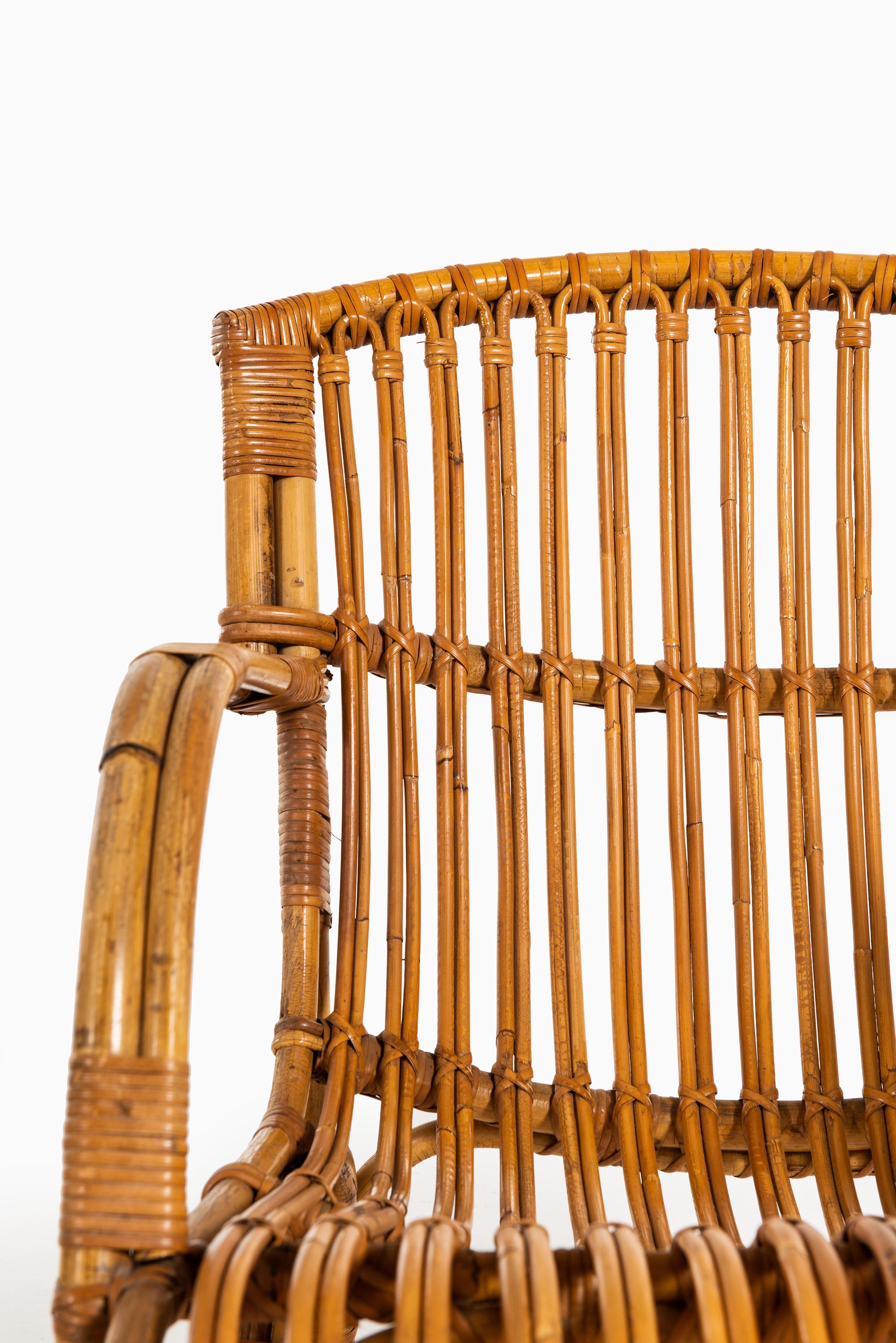 Danish Pair of Easy Chairs in Rattan and Cane by E.V.A. Nissen & Co in Denmark