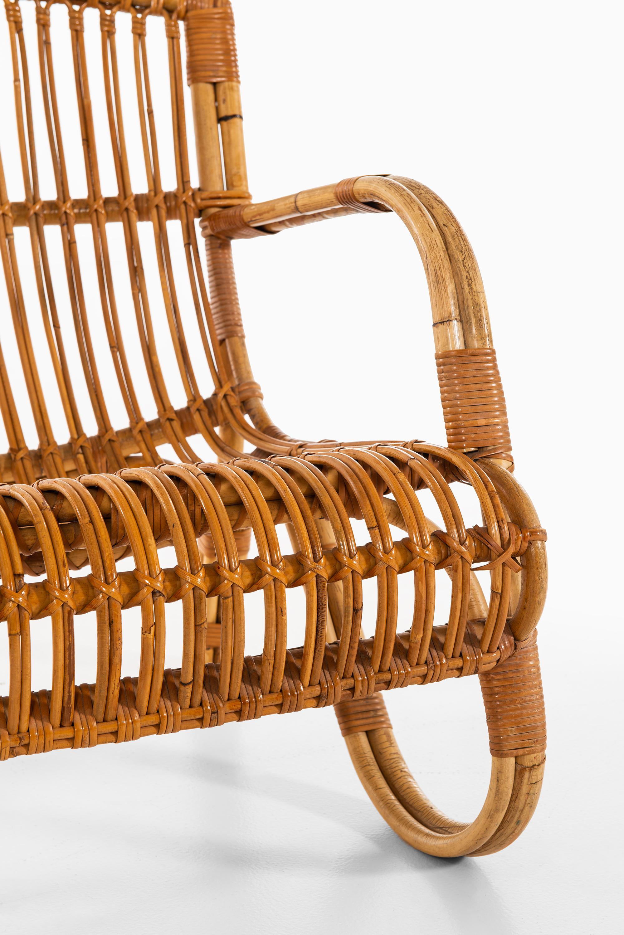 Mid-20th Century Pair of Easy Chairs in Rattan and Cane by E.V.A. Nissen & Co in Denmark