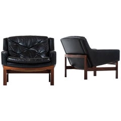 Pair of Easy Chairs in Rosewood and Black Leather Produced in Sweden