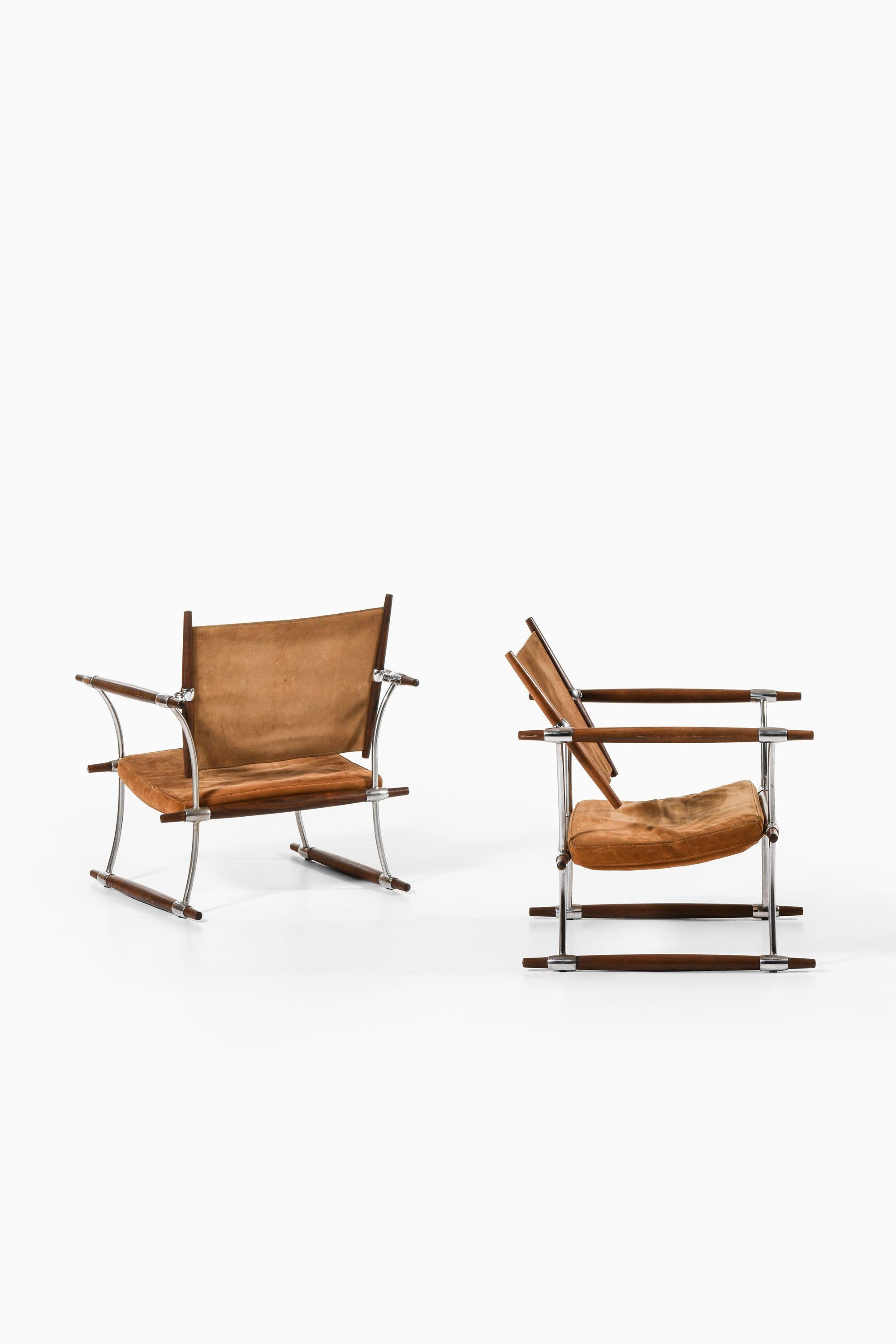 Scandinavian Modern Pair of Easy Chairs in Rosewood & Steel Frame by Jens Harald Quistgaard, 1960's For Sale