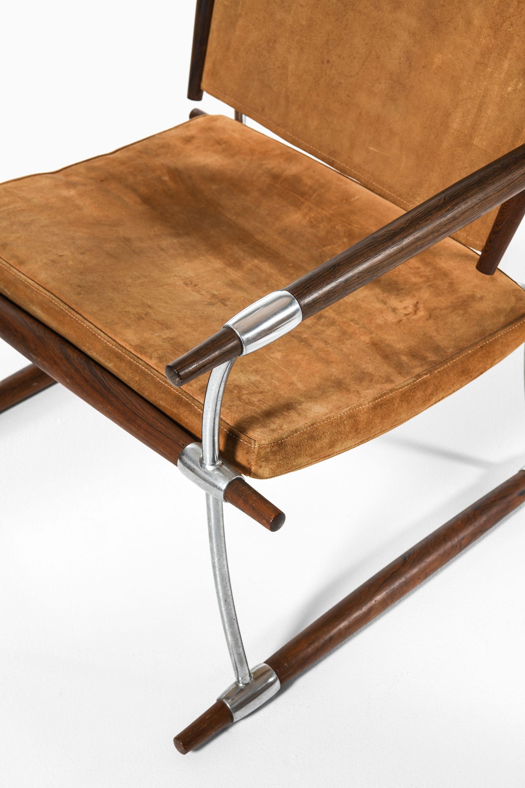Danish Pair of Easy Chairs in Rosewood & Steel Frame by Jens Harald Quistgaard, 1960's For Sale