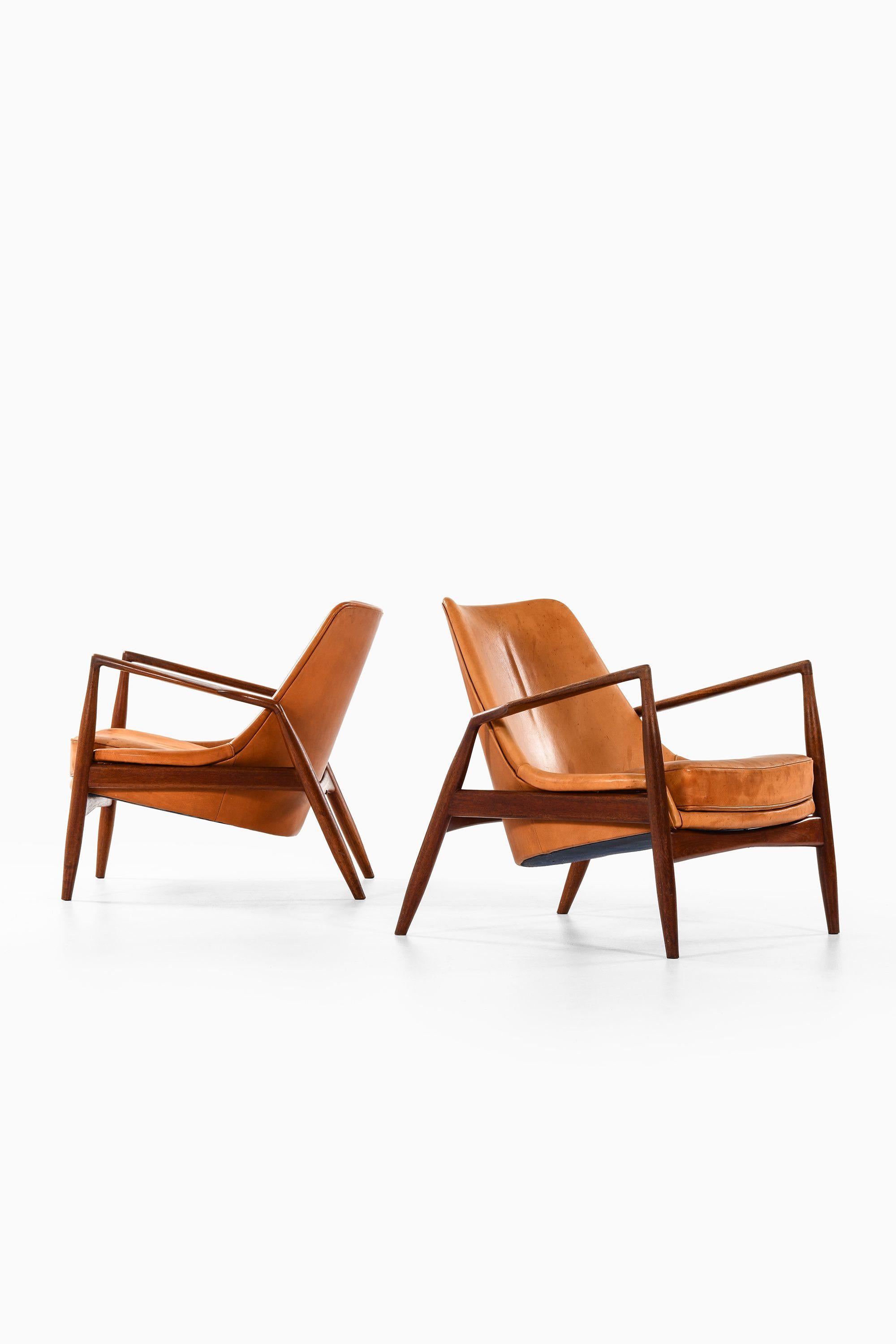 Swedish Pair of Easy Chairs in Teak and Leather by Ib Kofod-Larsen, 1950s For Sale