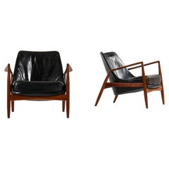 Pair of Easy Chairs in Teak and Original Black Leather by Ib Kofod-Larsen