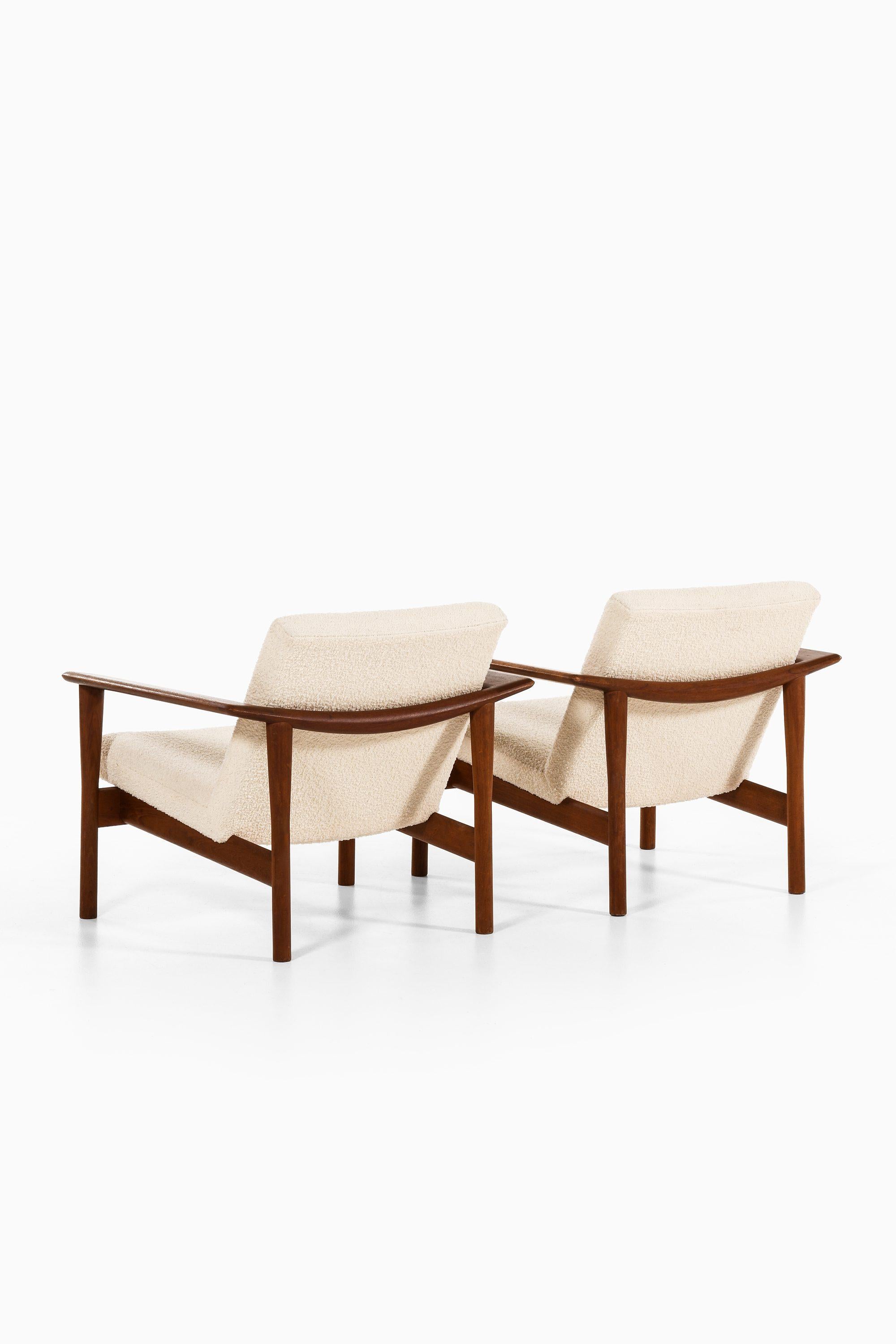 Danish Pair of Easy Chairs in Teak and Reupholstered in White Bouclé Fabric, 1950's For Sale