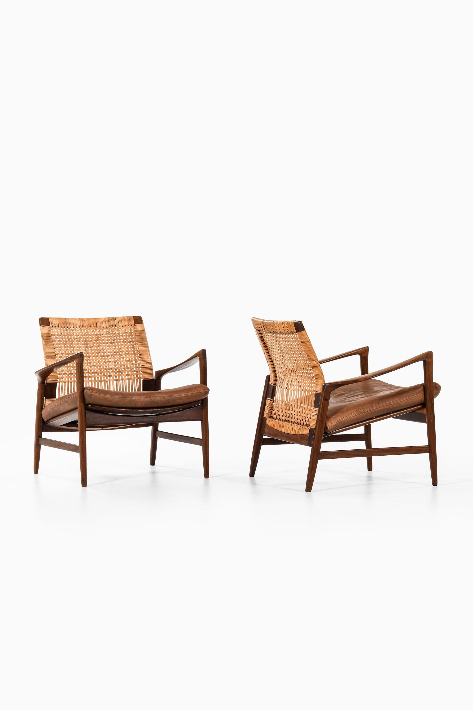 Pair of Easy Chairs in Teak, Cane with Original Brown Leather By Ib Kofod-Larsen, 1950’S

Additional Information:
Material: Teak, cane and original brown leather
Style: midcentury, Scandinavian
Very rare pair of easy chairs model Åre
Produced