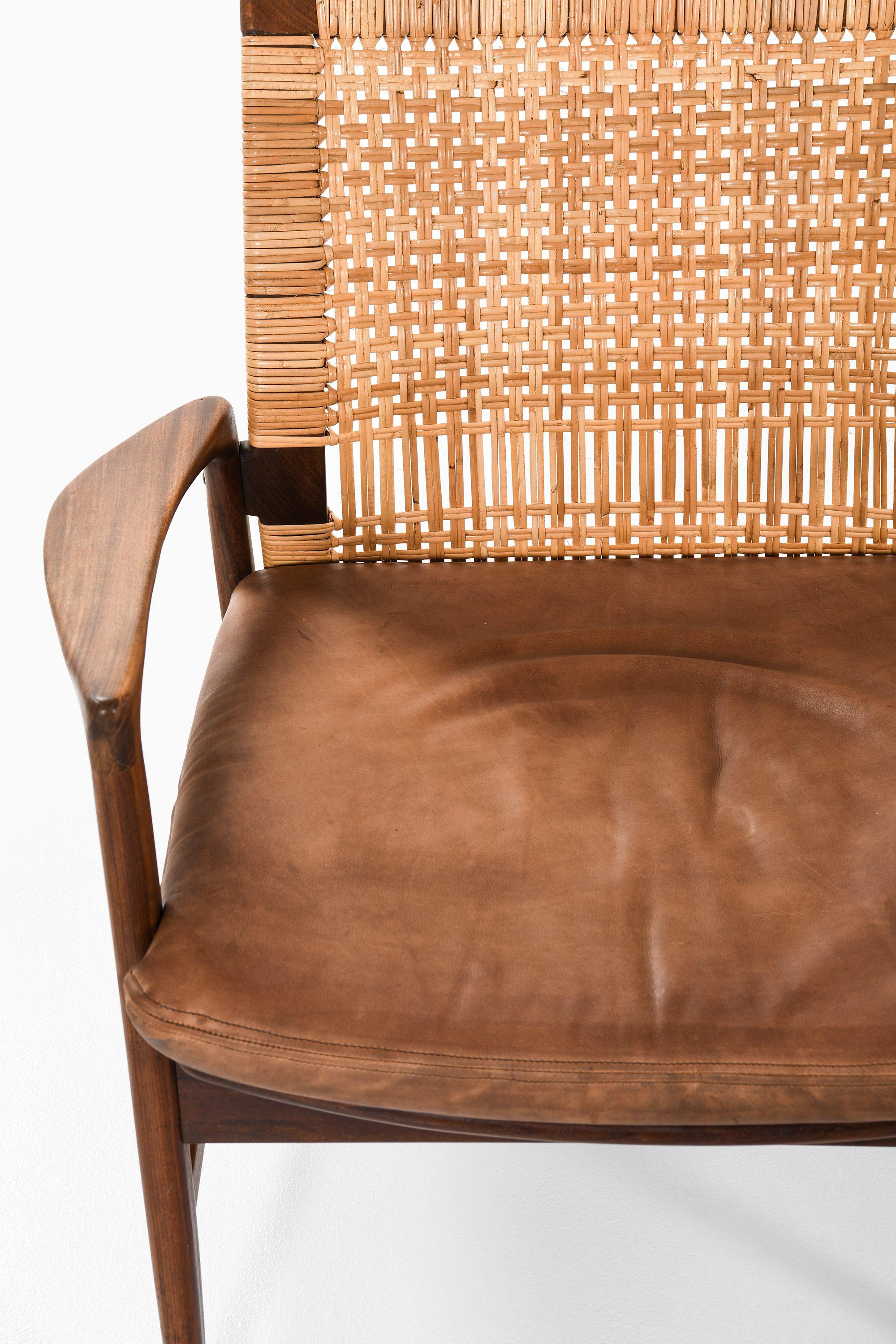 Swedish Pair of Easy Chairs in Teak, Cane with Brown Leather by Ib Kofod-Larsen, 1950s