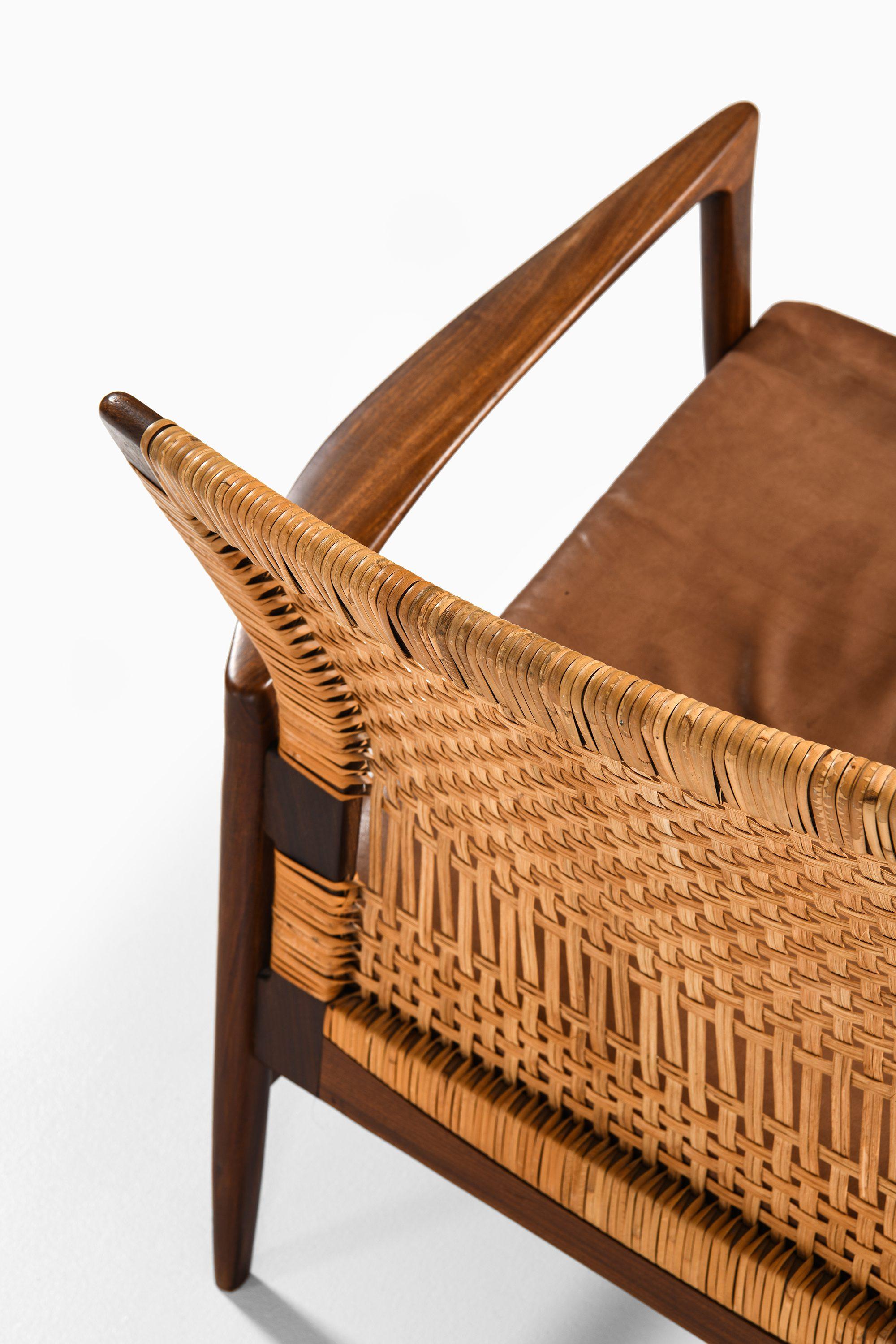 Pair of Easy Chairs in Teak, Cane with Brown Leather by Ib Kofod-Larsen, 1950s 2