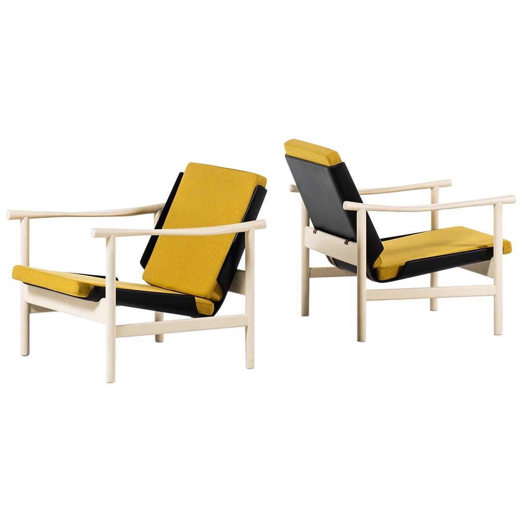 Pair of easy chairs in white and black lacquered wood produced in Denmark