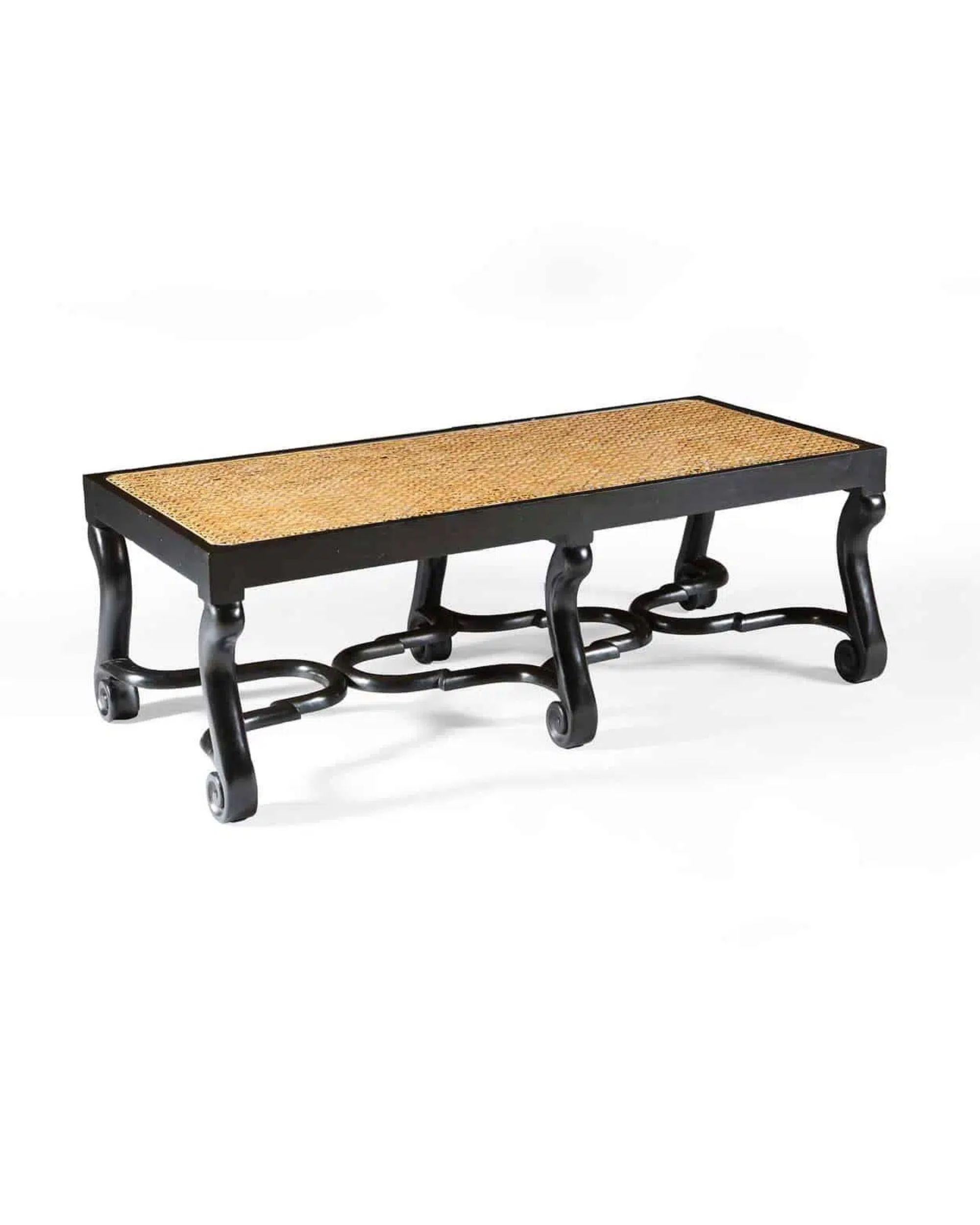 Ebonised Long caned bench with shaped voluted scrolled legs and moulded Jacobean stretchers.

Perfect used as window seats, a bench or low table

Additional information: 
Origin: England
Dimensions:
Depth: 53.5 cm (21.06 inches)
Height of Seat: 40