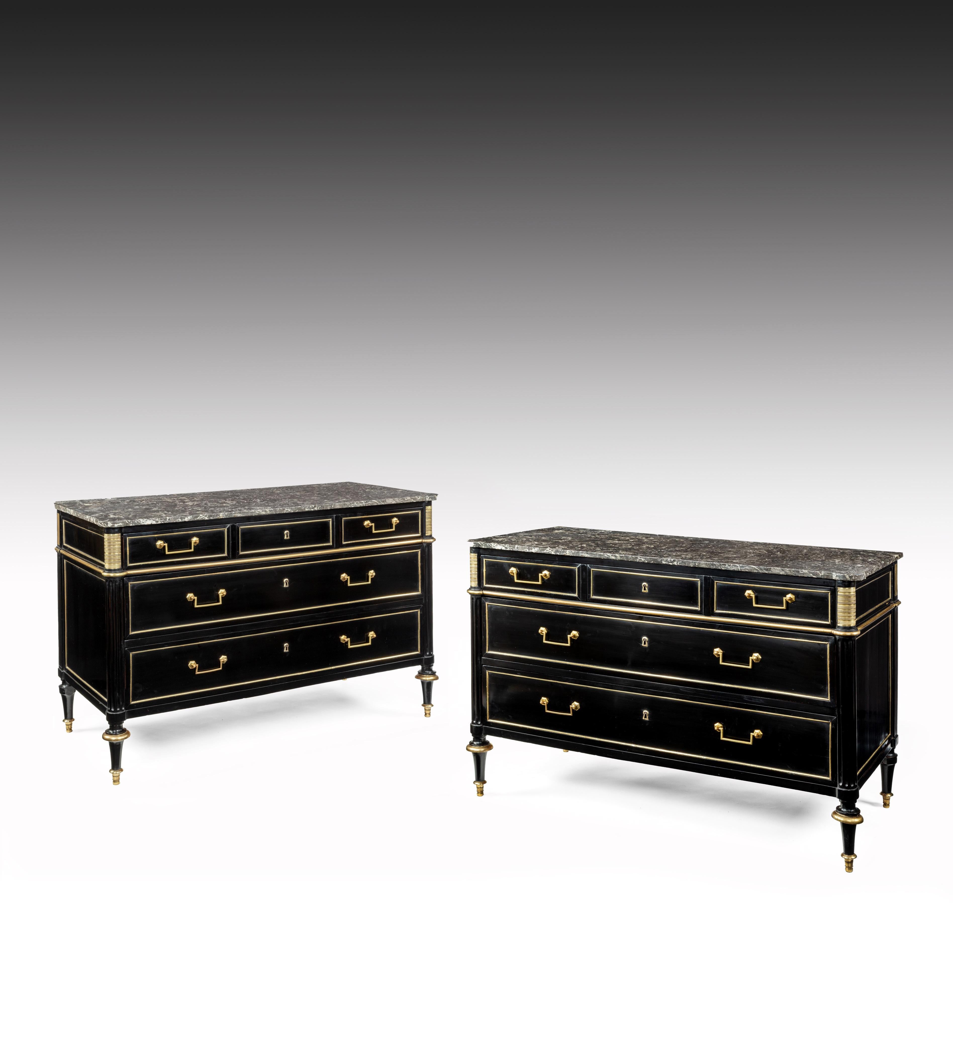 A stunning and decorative pair of French Directoire period ebonised and brass mounted marble topped commodes.

French, circa 1800.

A fine quality closely matched pair of late 18th-early 19th century ebonised Directoire commodes with ‘Gris St