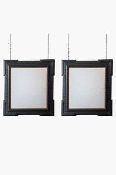 Pair of Ebonised Guilloche Framed Mirrors