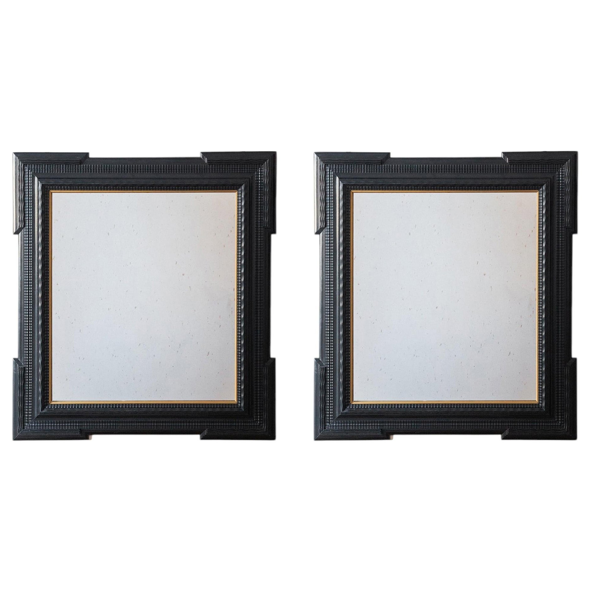 Pair of Ebonised Guilloche Framed Mirrors