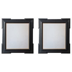 Pair of Ebonised Guilloche Framed Mirrors