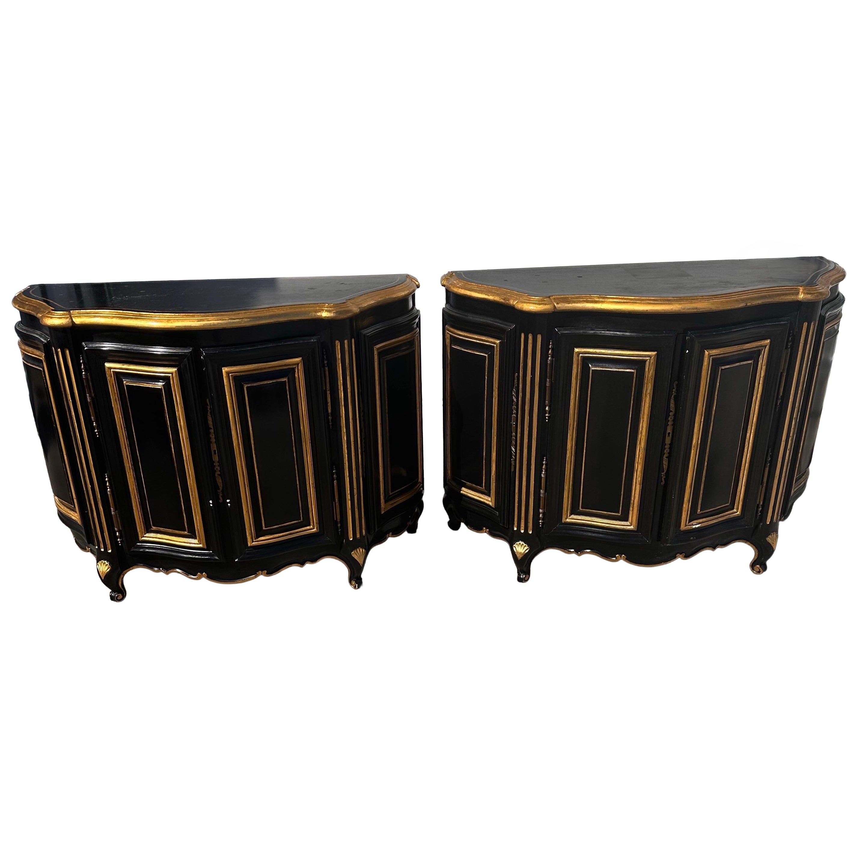 Pair of Ebonized and gilt Demi lune Cabinets