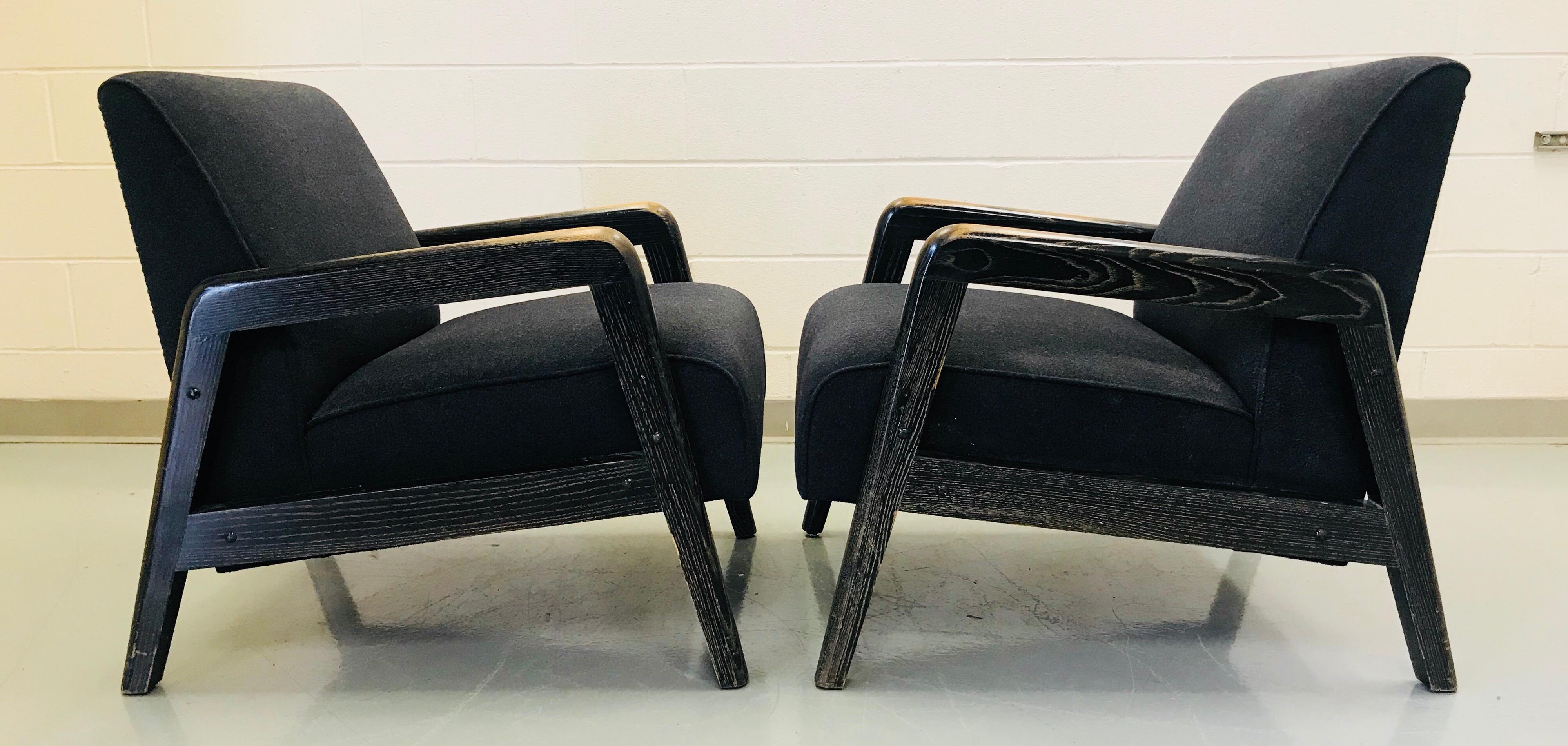 Pair of ebonized cerused wood lounge chairs. They have recently been reupholstered.