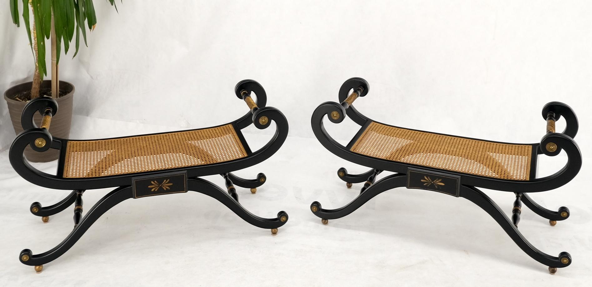 Pair of ebonized finish cane seat wide slayed ball points legs benches.
Gold gilt carved twisted rope side hand rails.