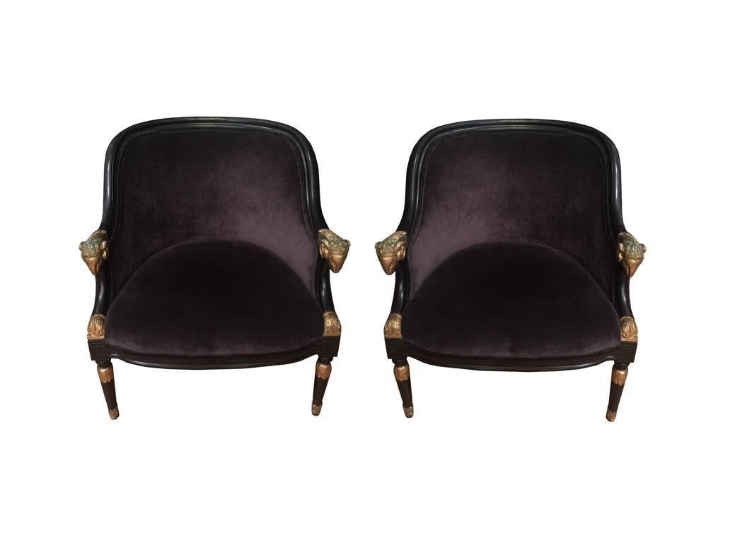 Mid-20th Century Pair of Ebonized & Gilt Bergère Chairs with Carved Ram Heads For Sale