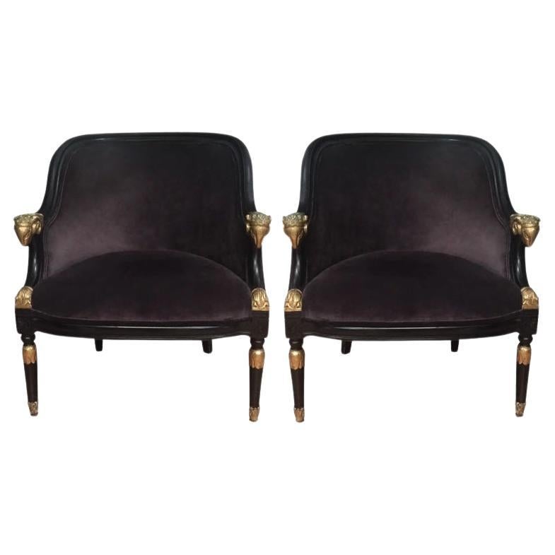 Pair of Ebonized & Gilt Bergère Chairs with Carved Ram Heads For Sale