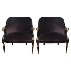 Pair of Ebonized & Gilt Bergère Chairs with Carved Ram Heads
