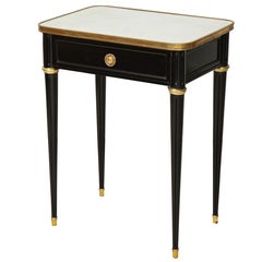 Pair of Ebonized Jansen Marble Top End Tables In The Louis XVI Manner