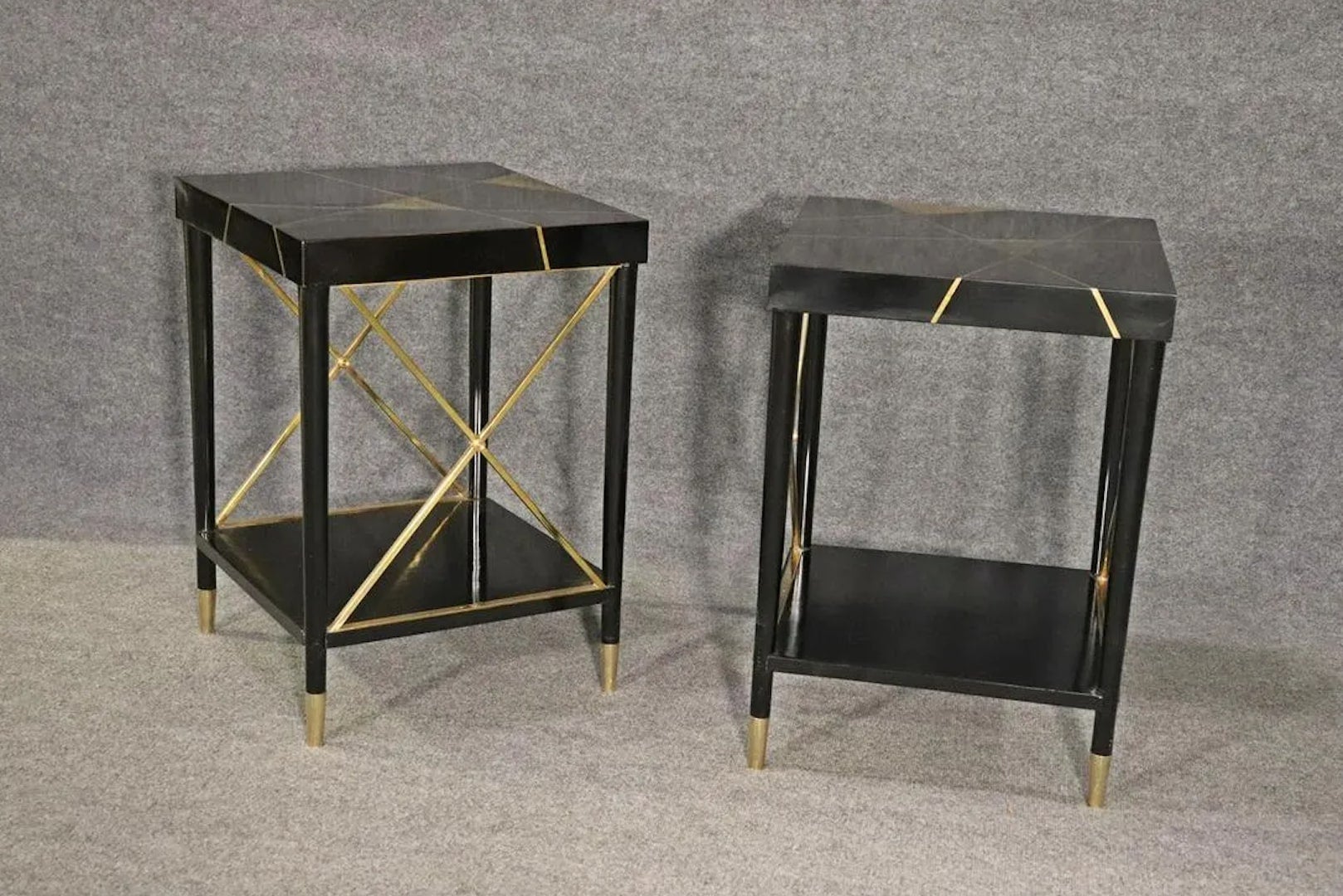 Pair of side tables in black ebonized wood with brass inlay accents. 
Please confirm location.