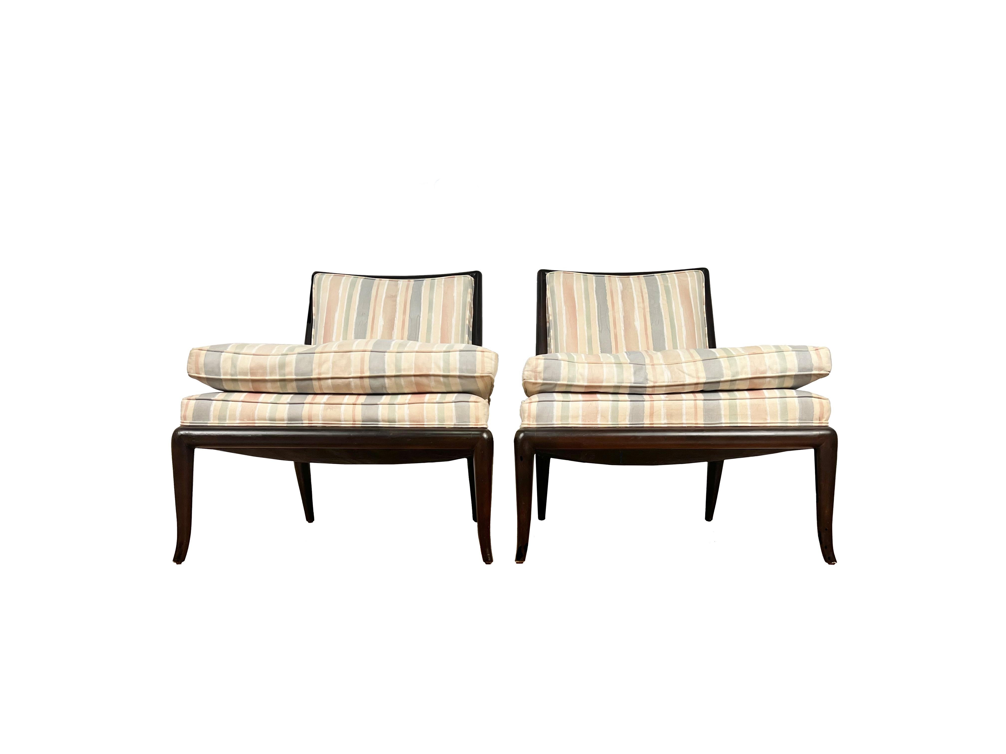 These stunning classic WMB slipper chairs are a timeless and elegant design by T.H.Robsjohn Gibbings and were manufactured by Widdicomb in the 1950s. This versatile pair could be at home in any home or office and work with many different styles. The