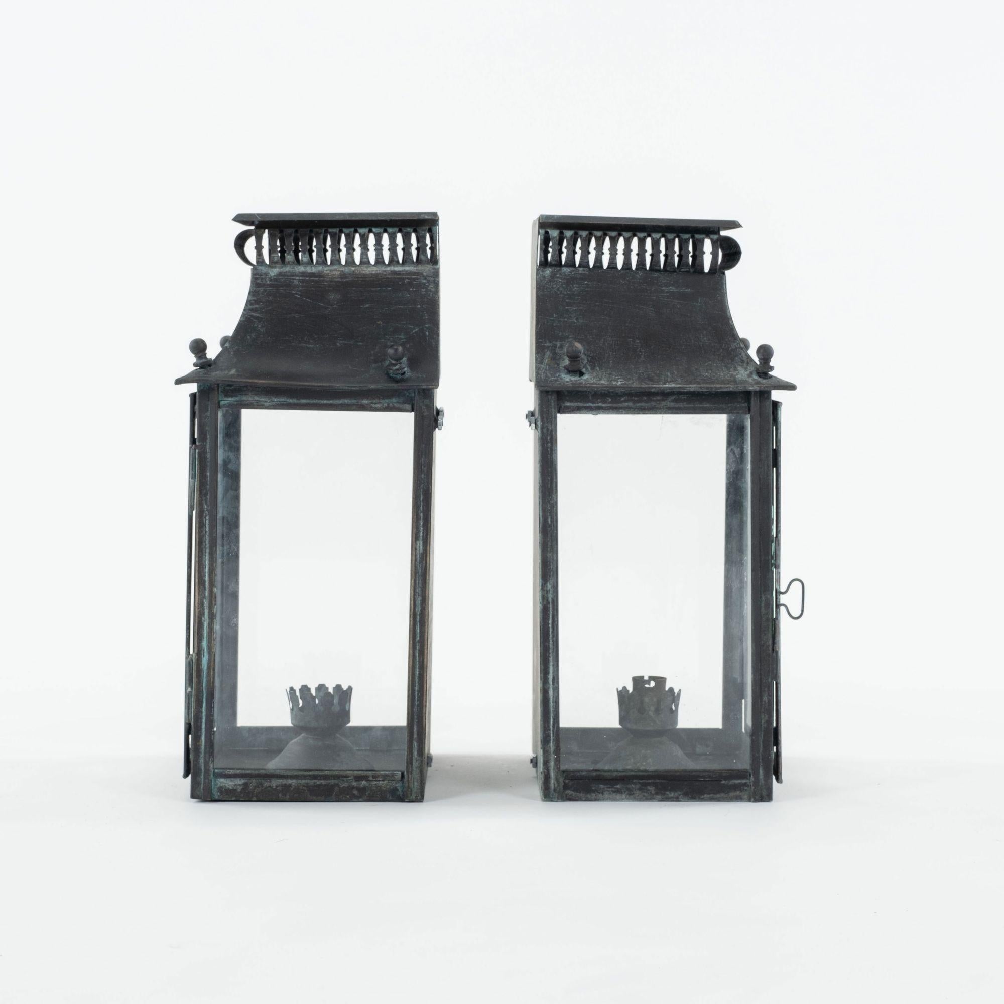 Brass Pair of Ebonized Tole and Glass Wall-Mounted Lanterns