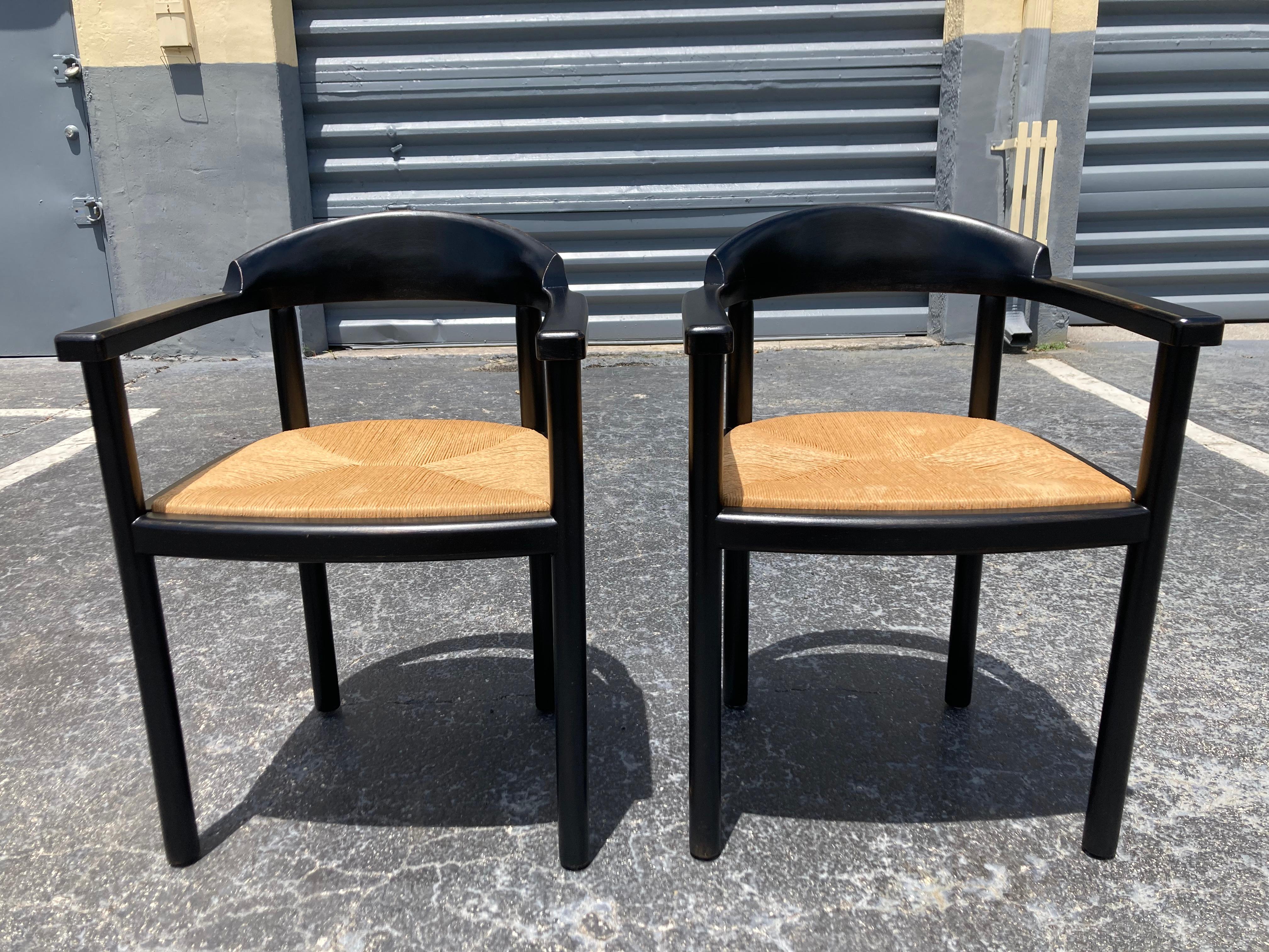 Pair of Ebonized Wood Arm Chairs with Rush Seats from the 1960s. 
 Sturdy and ready for new home.