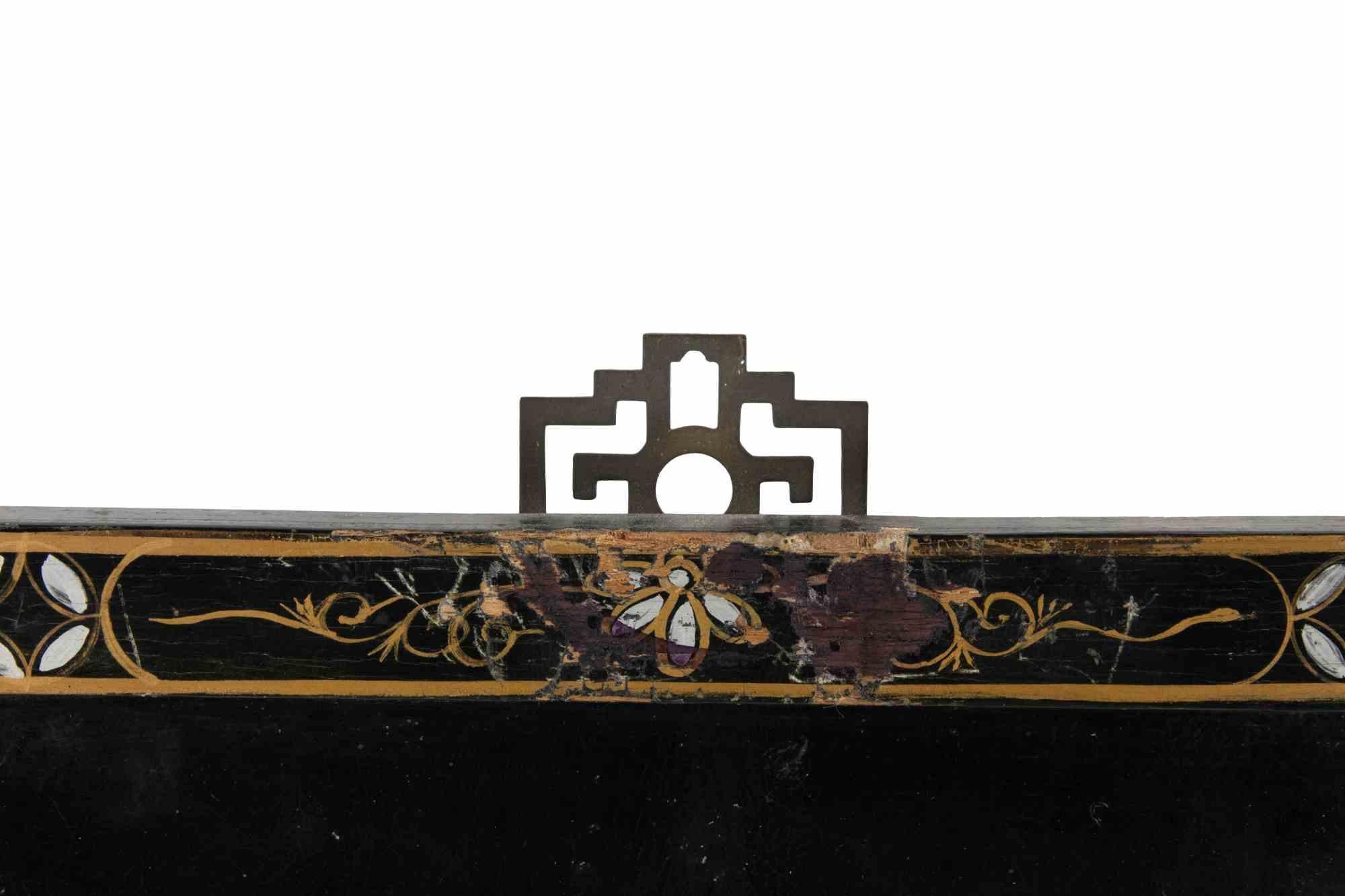 Pair of ebonized wooden panels decorated in mother-of-pearl and impasto with characters and pagodas.

China, early 20th Century.

Some minor losses, especially in the external frame.