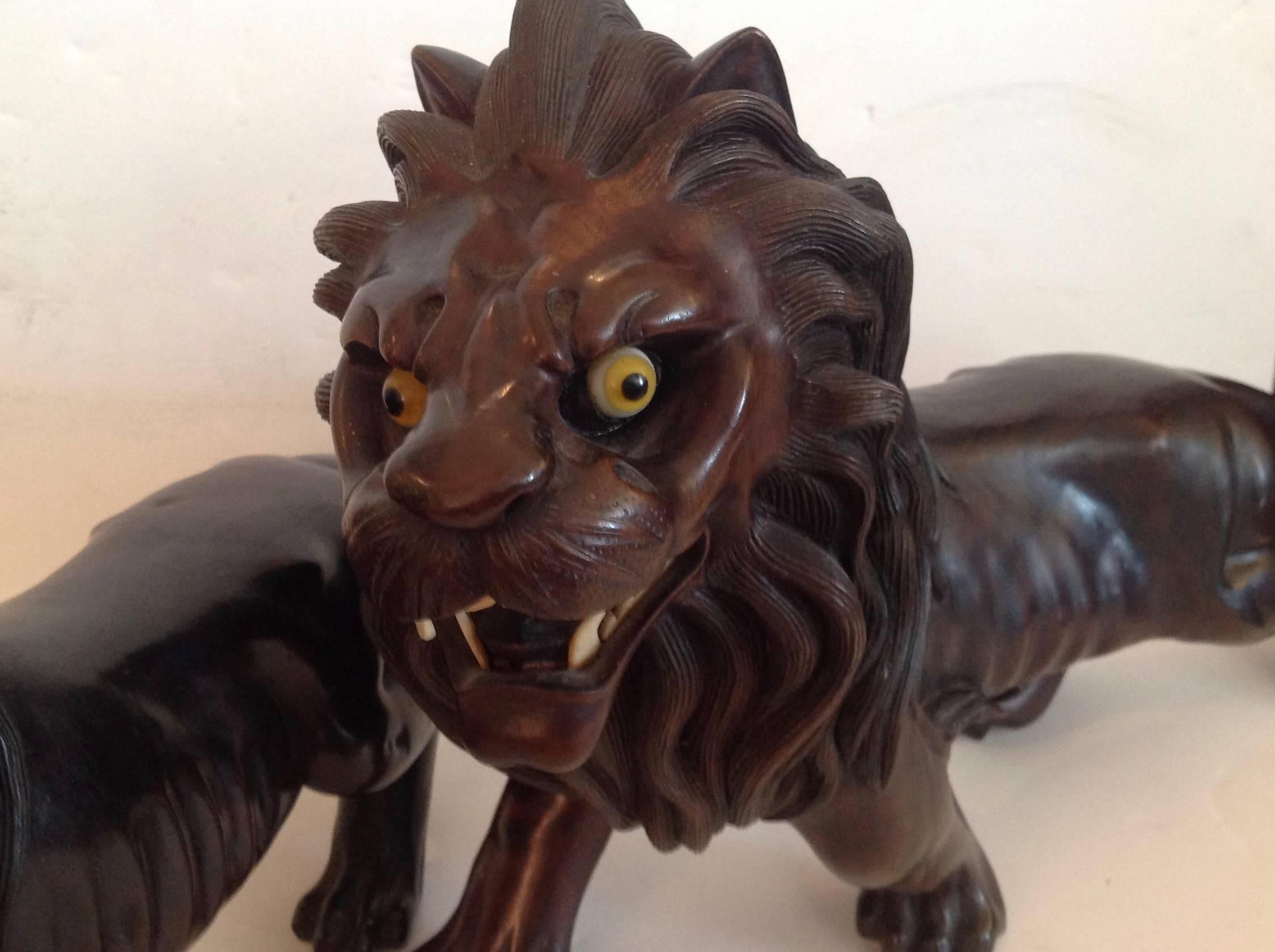 Pair of Ebony Indo, Burmese Figures of Lions In Good Condition In West Palm Beach, FL