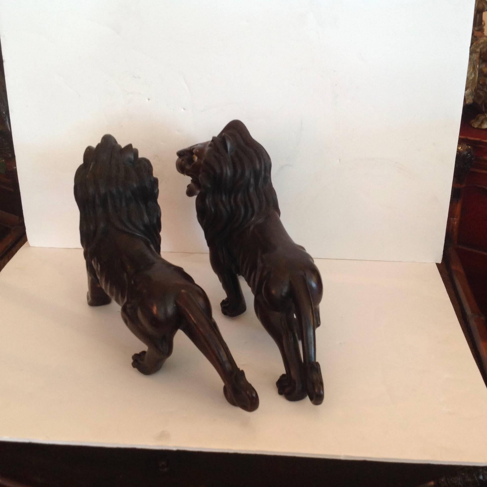 Glass Pair of Ebony Indo, Burmese Figures of Lions